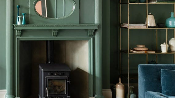 Living room with walls and fireplace painted in Farrow & Ball Green Smoke