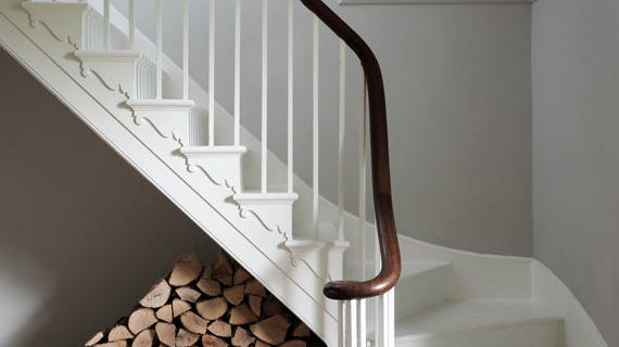 Hallway and staircase painted in Farrow & Ball Cornforth White