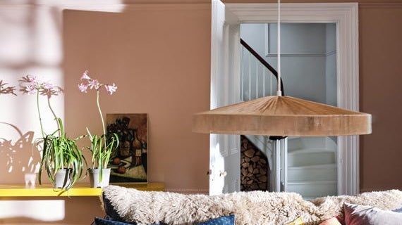 Warm pink living room walls painted in Farrow & Ball Setting Plaster
