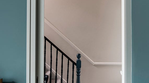 Hallway with walls painted in Farrow & Ball Inchyra Blue