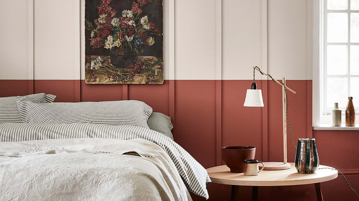 Bedroom painted in Little Greene French Grey with Tuscan Red