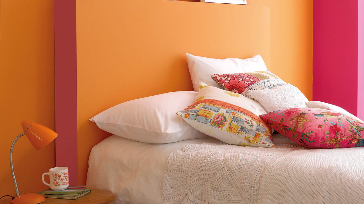 Bedroom painted in Little Greene Marigold, Carmine and Leather