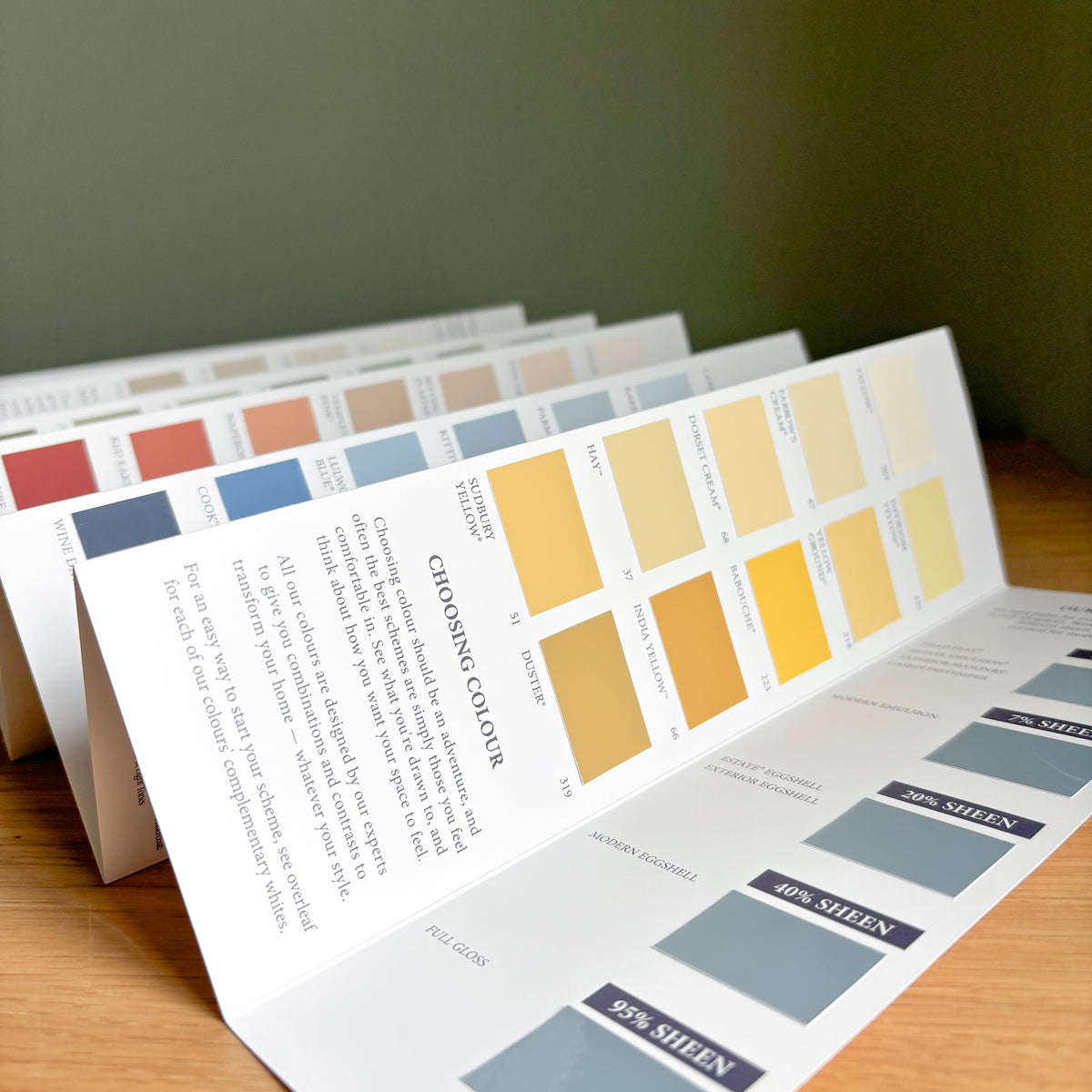 Farrow & Ball colour card open to show a range of paint swatches