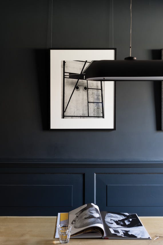Dining room with panelled walls painted in Farrow & Ball Railings