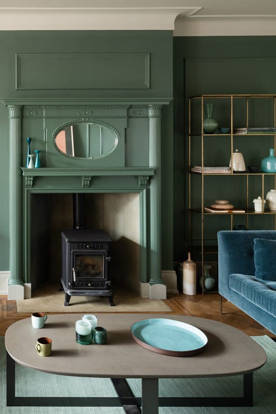 Living room with walls and fireplace painted in Farrow & Ball Green Smoke