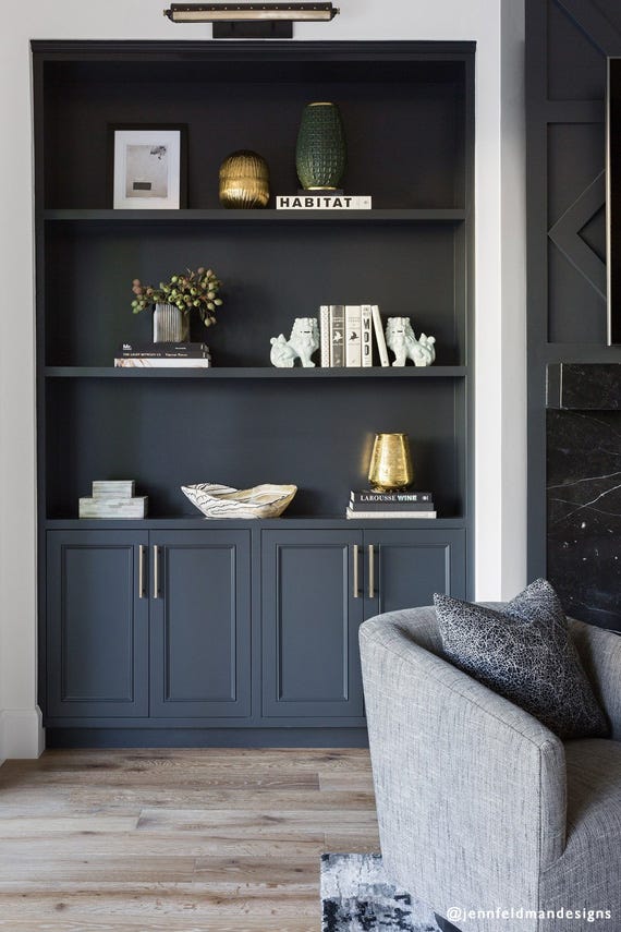 Built-in cupboards and shelving painted in Farrow & Ball Off-Black