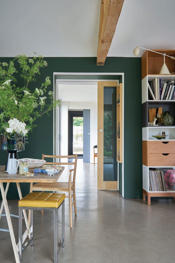 Kitchen and dining room with walls painted in Farrow & Ball Studio Green