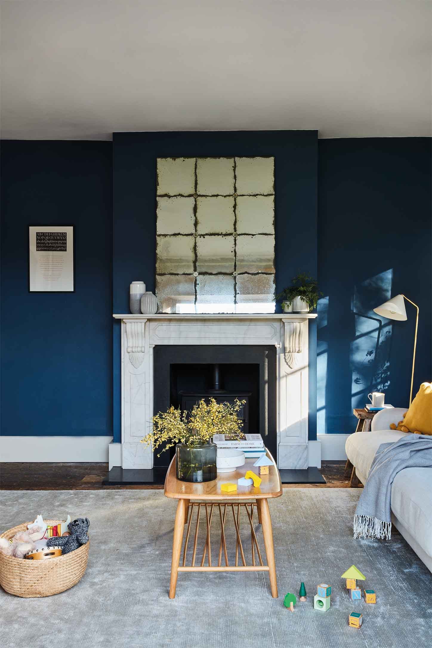 Sitting room with walls painted in Farrow & Ball Stiffkey Blue