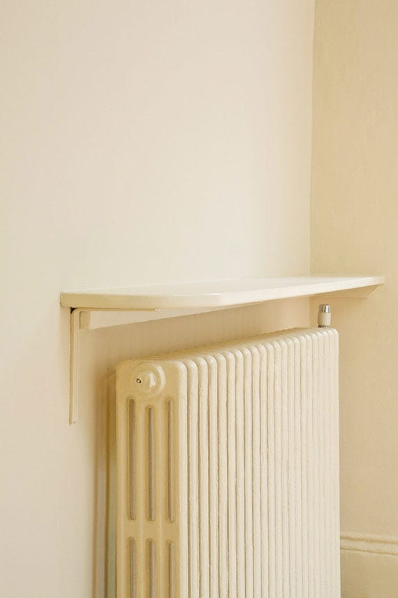 Radiator and shelf painted in Farrow & Ball Matchstick