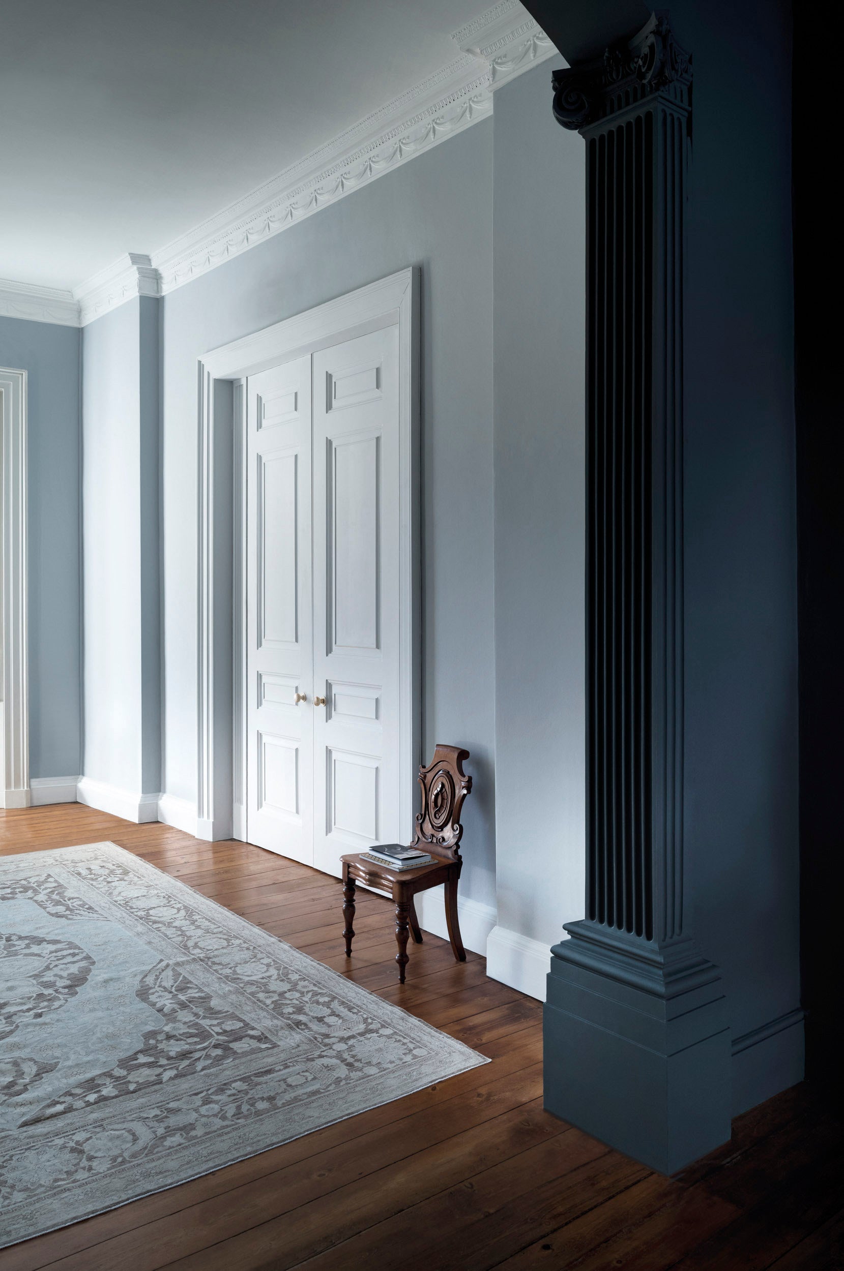 Painted skirting boards and door in a hallway, Paint & Paper Library Lead and Squid Ink