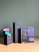 Paint & Paper Library colour cards displayed with premium paint brand samples